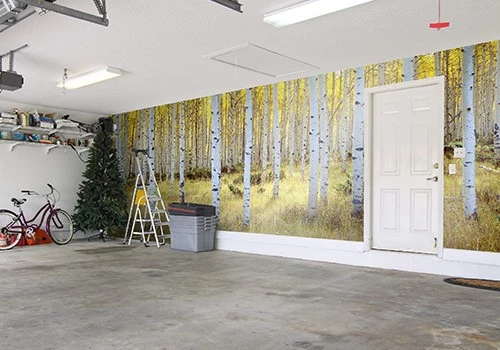 A mural of trees in a garage.