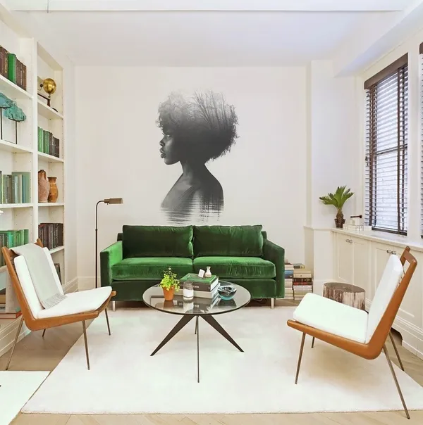 A study room with a mural of a woman on the wall.