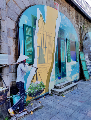 A mural depicting a torn door.